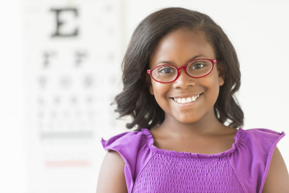 Girl with glasses at eye doctor