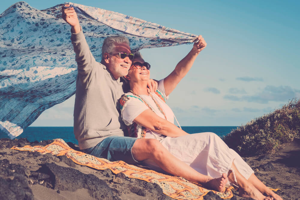 Older man and woman at the beach