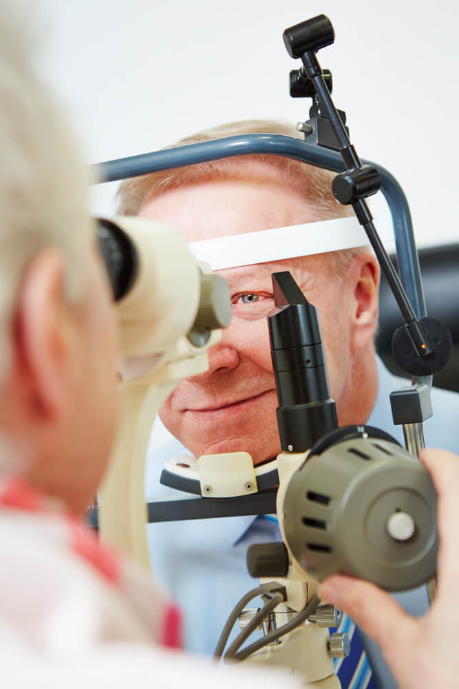 Man having his eyes examined