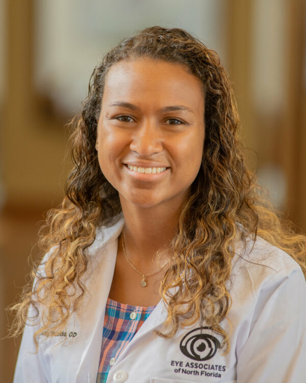 Dr. Ruzicka headshot, smiling in white lab coat