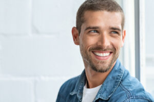 man looking out the window smiling