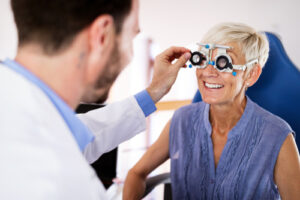 eye doctor performing eye exam on patient 